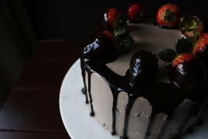 Chocolate Dipped Strawberry Cake. A romantic, dense and fluffy chocolate cake with a ganache meringue frosting.