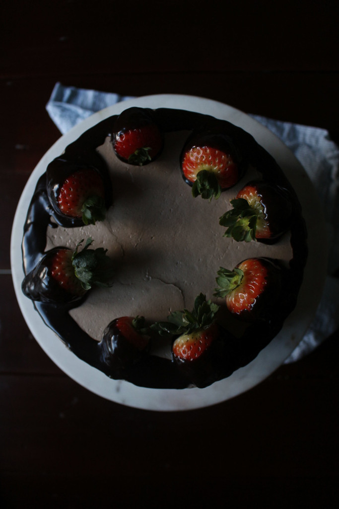 Chocolate Dipped Strawberry Cake. A romantic, dense and fluffy chocolate cake with a ganache meringue frosting.