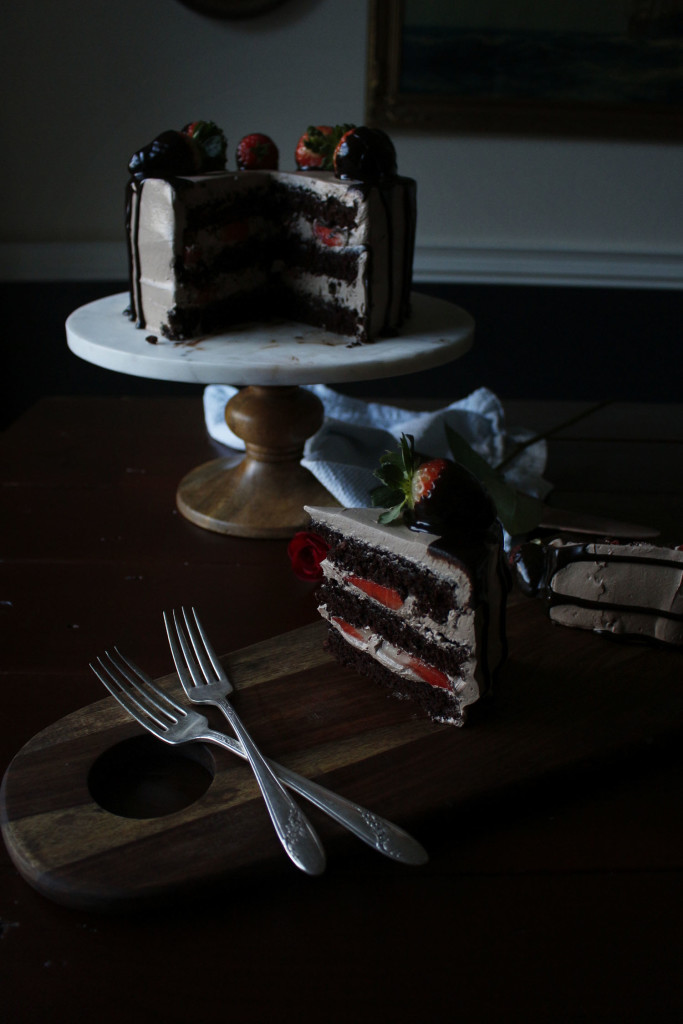 Chocolate Dipped Strawberry Cake. A romantic, dense and fluffy chocolate cake with a ganache meringue frosting.