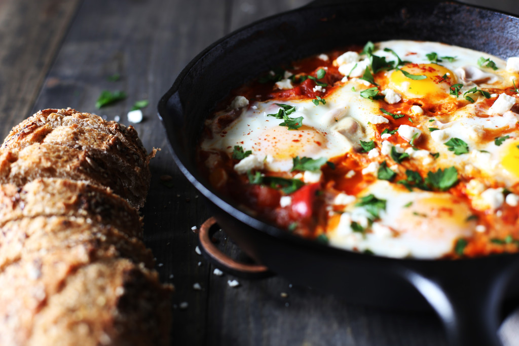 Shakshuka for two! Poached eggs in a tomato sauce warmed with cumin and smoked paprika sprinkled with feta cheese.