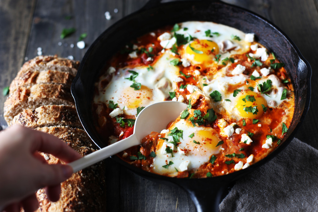 Shakshuka for two! Poached eggs in a tomato sauce warmed with cumin and smoked paprika sprinkled with feta cheese.