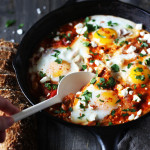 Shakshuka for two! Poached eggs in a tomato sauce warmed with cumin and smoked paprika sprinkled with feta cheese.