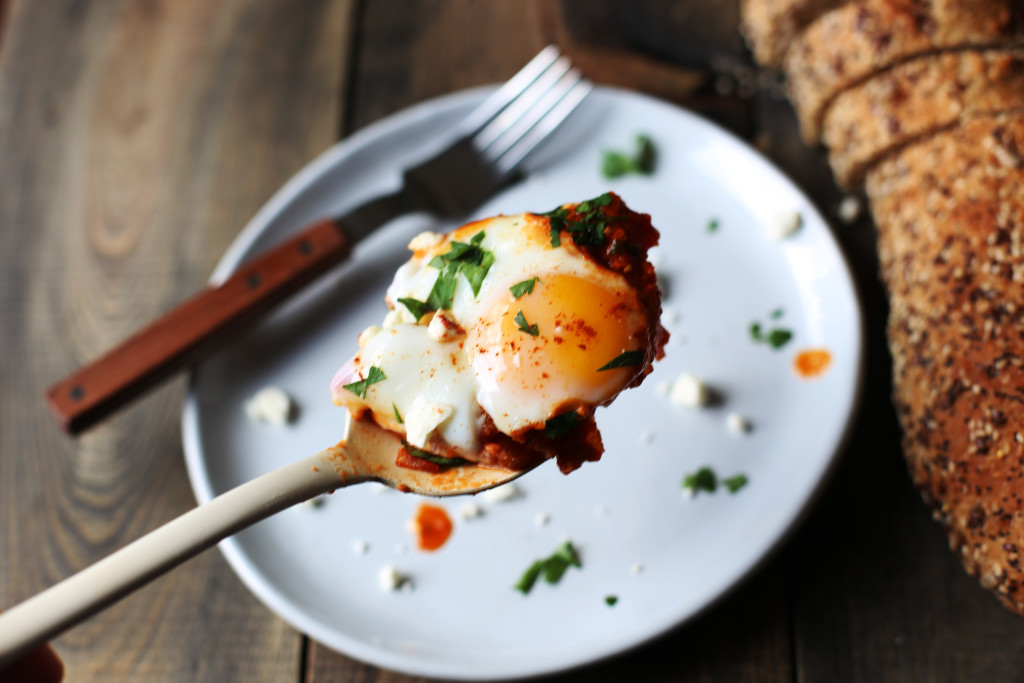 Shakshuka for two! Poached eggs in a tomato sauce warmed with cumin and smoked paprika sprinkled with feta cheese.