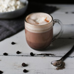 Cardamom and Honey Hot Chocolate, perfect for raining days and reading a book. Light herbal flavors and a fluffy honey whipped topping.
