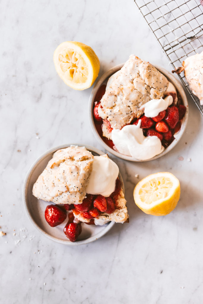 overhead image of two plates of Lemon Poppy Seed Strawberry Shortcake