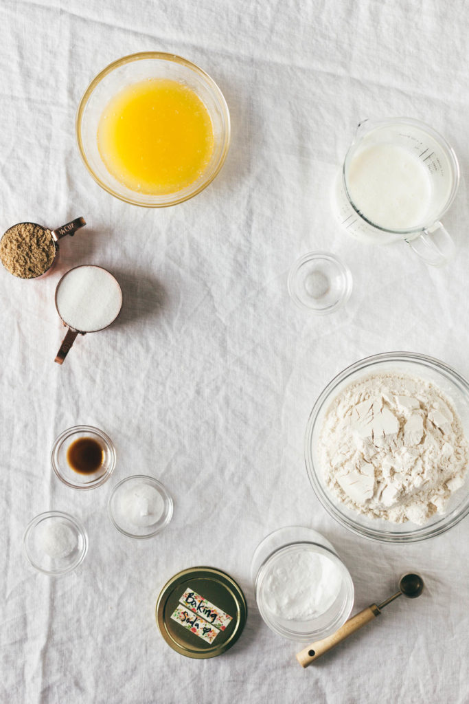 Overhead shot of the ingredients for the recipe of Baked Buttermilk Frosted Mini Donuts.