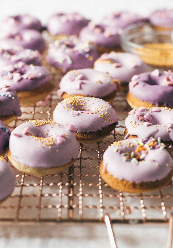 Angled shot of Baked Buttermilk Frosted Mini Donuts.