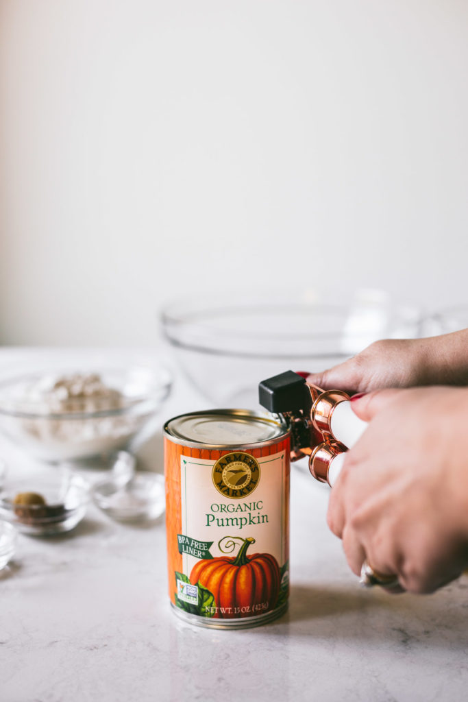 a can opener opening Farmers Market Foods pumpkin pure'