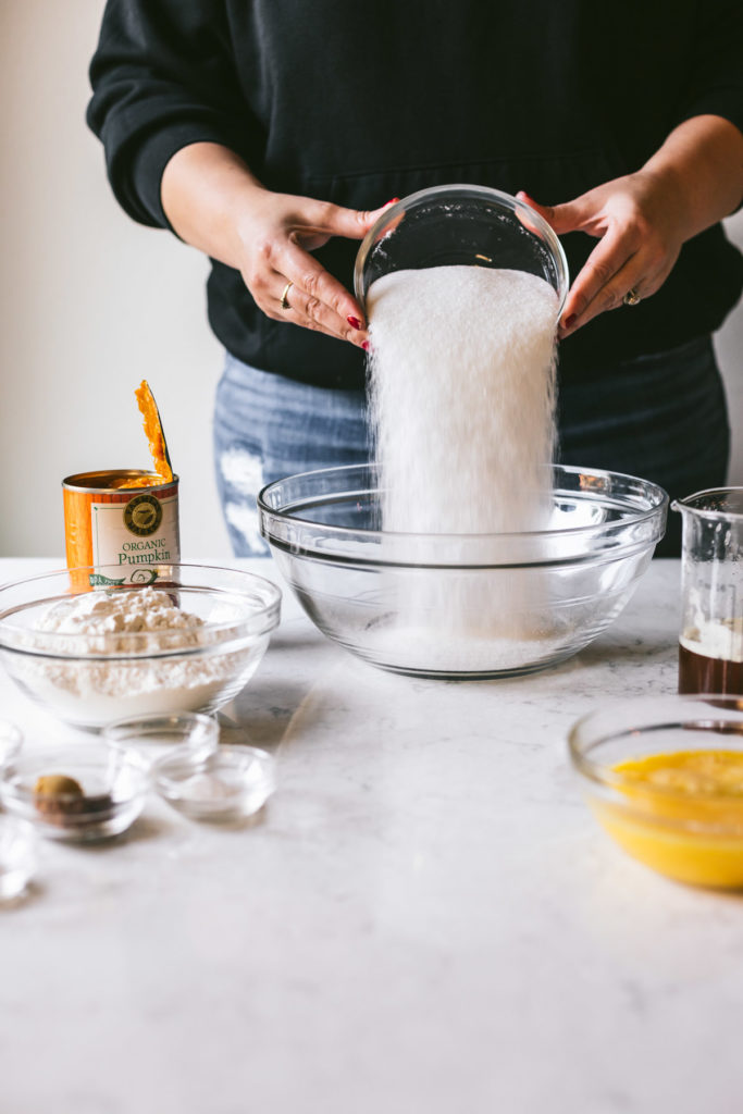 head on image of Karlee pouring sugar into a glass bowl