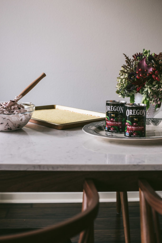 Head on image of a table with the cake ready to be rolled.