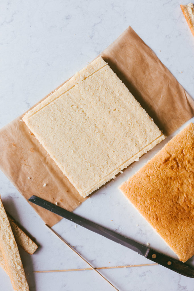 The two layers of the square yellow cake opened