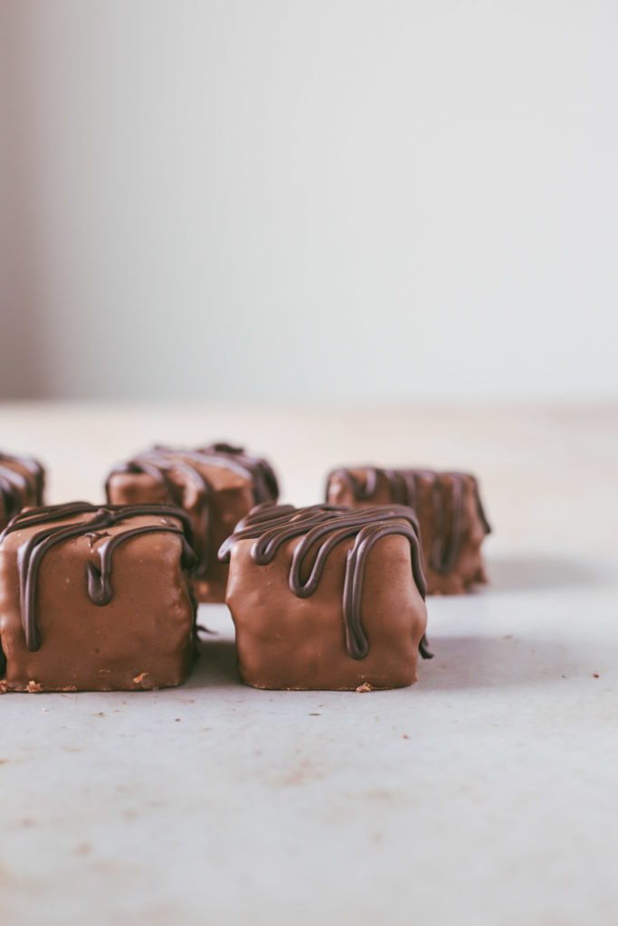 a head on image of the square, chocolate petit fours.