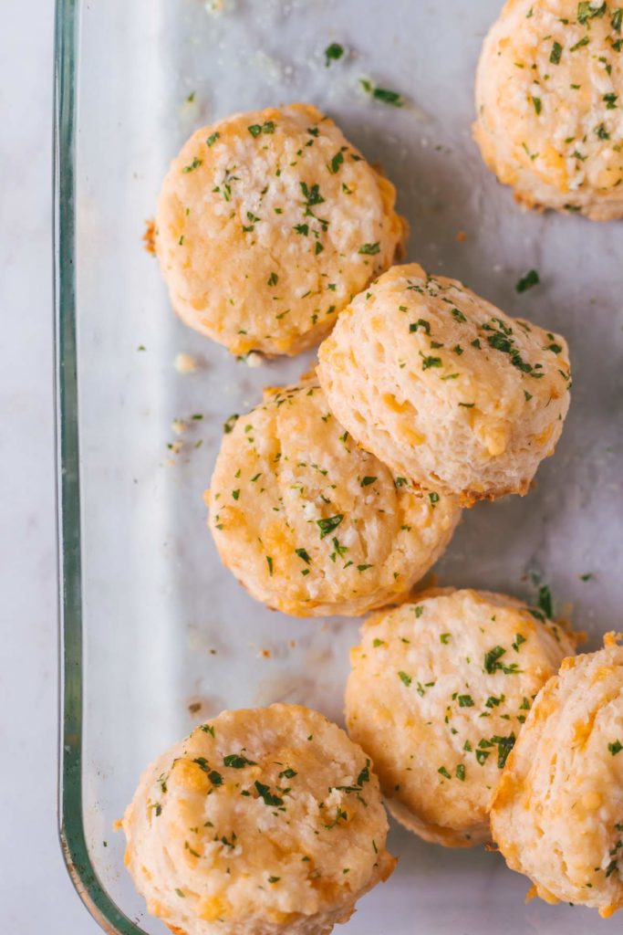 An overhead shot of a baking dish full of Cheddar Biscuits