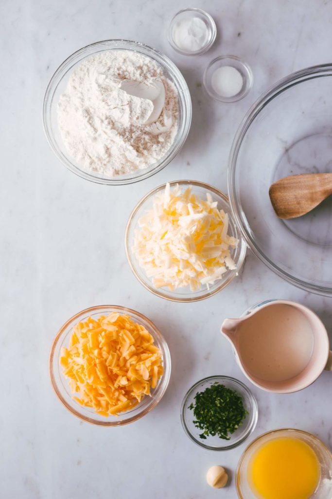 Over head shot of Cheddar Biscuit's ingredients in glass bowls.