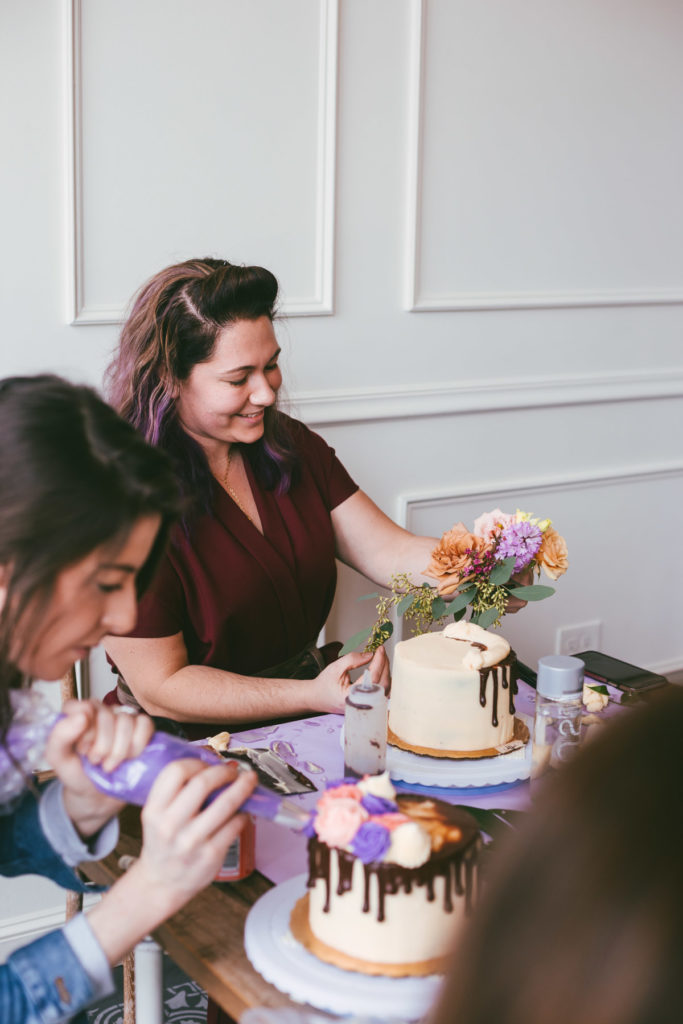 long table with flowers and cakes decorated