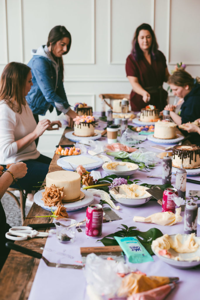 long table with flowers and cakes decorated