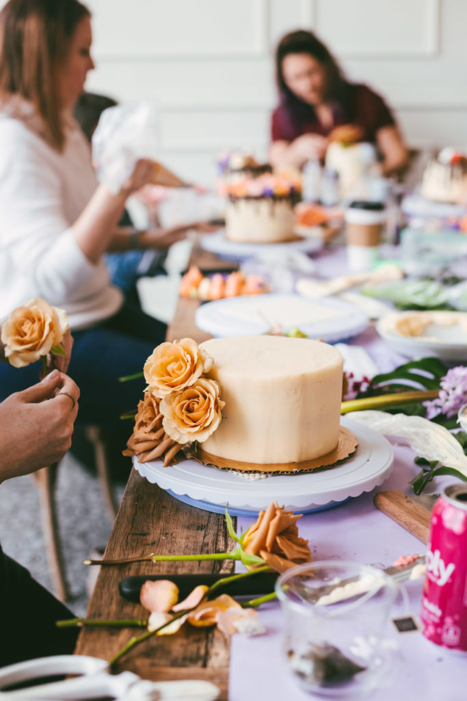 long table with flowers and cakes decorated