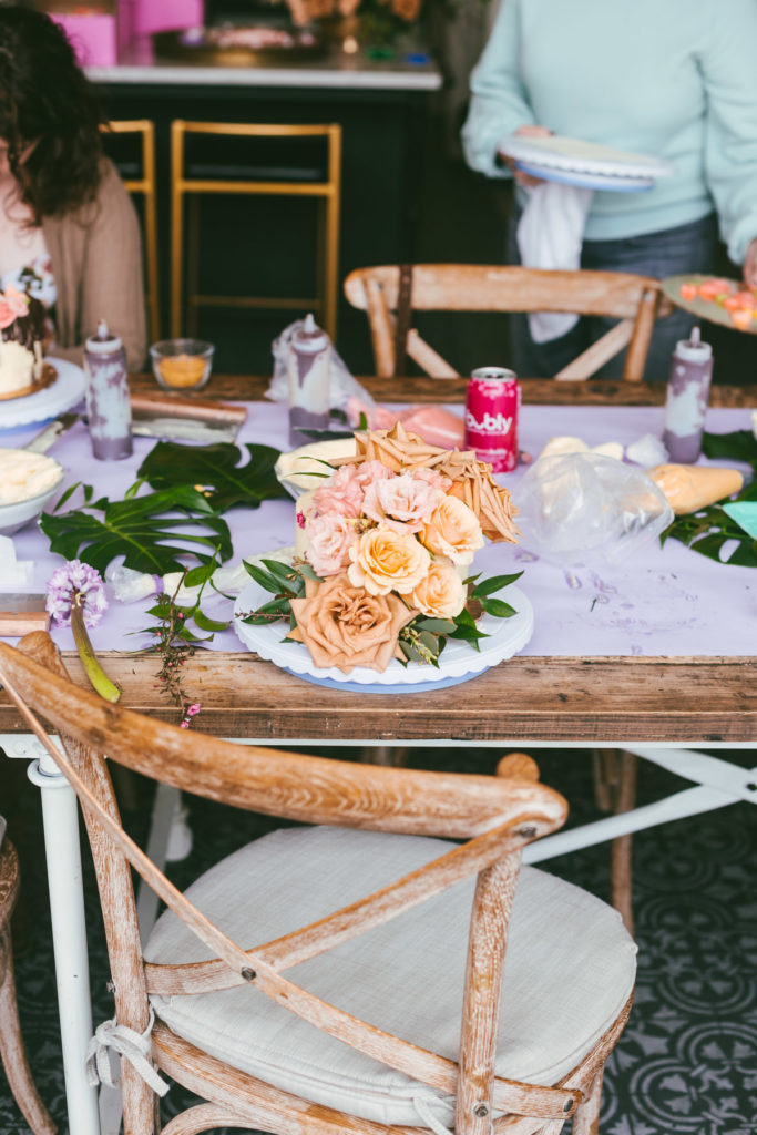 long table with flowers and cakes decorated