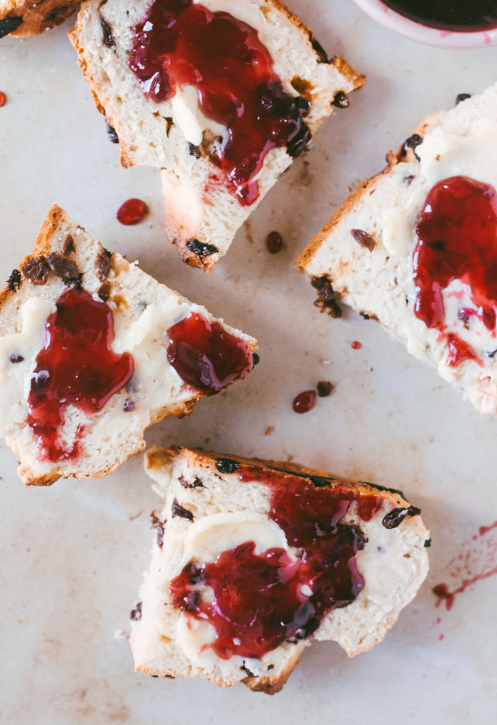 Overhead image of sliced, buttered and jammed Irish soda bread