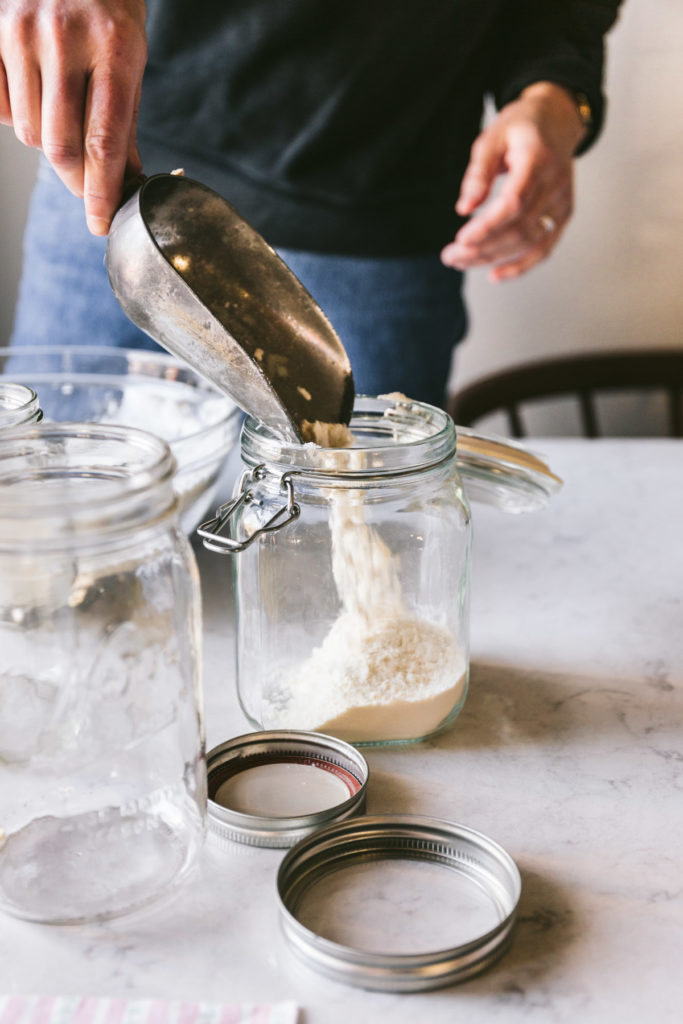 buttermilk pancake mix being poured into a jar