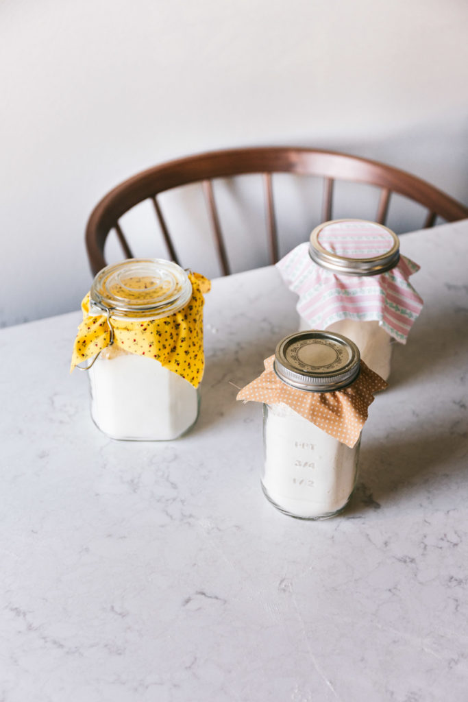 overhead image of three mason jars filled with buttermilk pancake mix