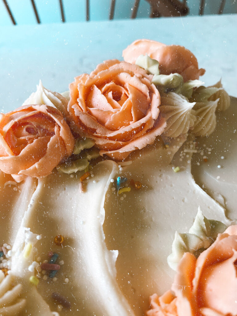 a cake with buttercream roses