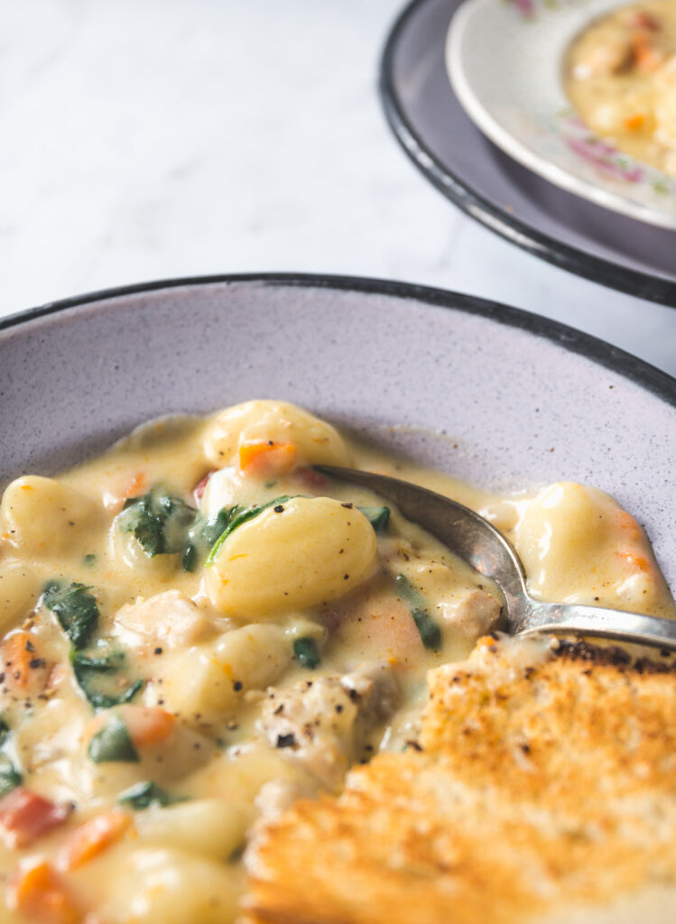 close up of gnocchi in Creamy Chicken Gnocchi Soup