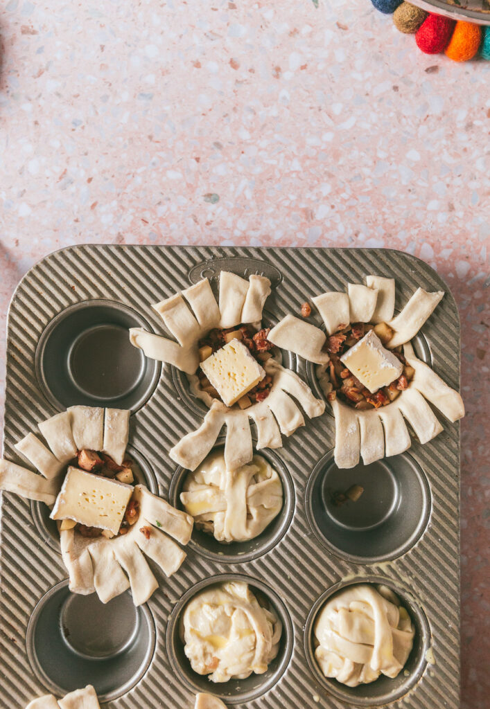 pastry in the muffin tin stuffed with the filling