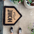 Front door mat and flowers