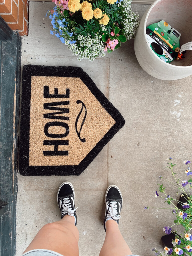 Front door mat and flowers